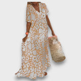 Dolga obleka z cvetličnim vzorcem in gumbi