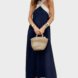 Elegantna obleka z odprtim hrbtom in modernim prečnim ovratnikom