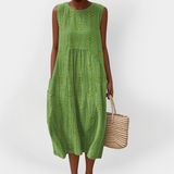 Elegantna brezrokavnik obleka iz bombaža z žepi