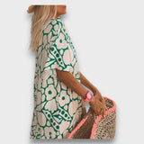 Dolga obleka z cvetličnim vzorcem in gumbi