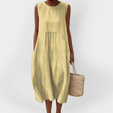 Elegantna brezrokavnik obleka iz bombaža z žepi