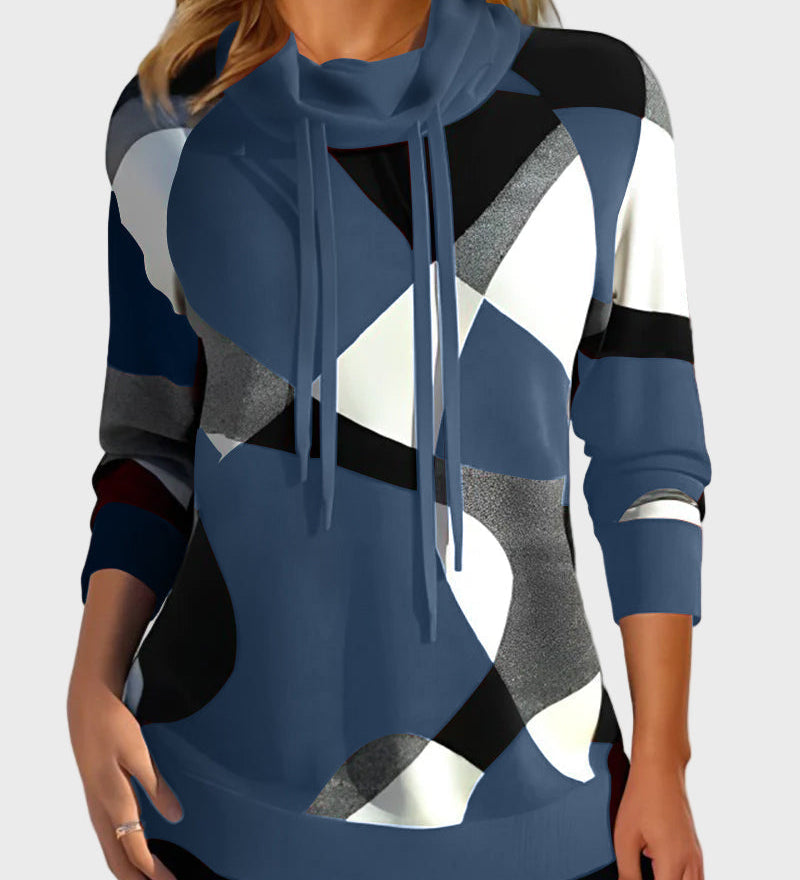 Pleteni pulover z umetniškim vzorcem in kapuco