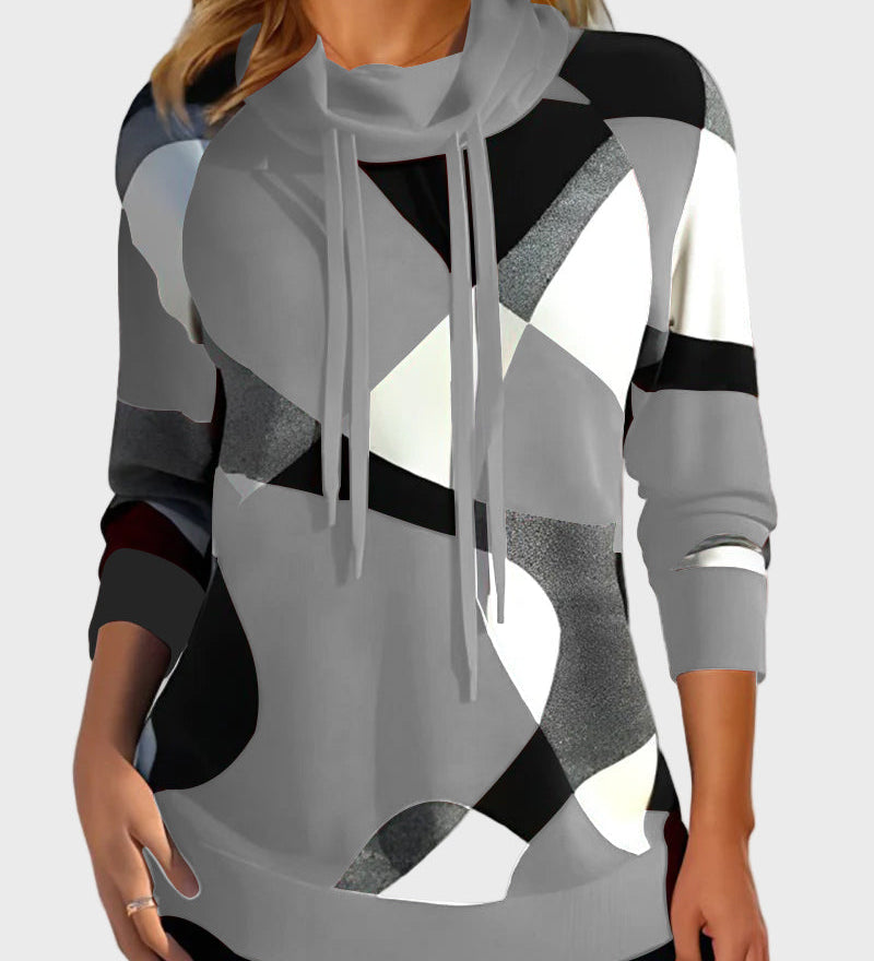 Pleteni pulover z umetniškim vzorcem in kapuco