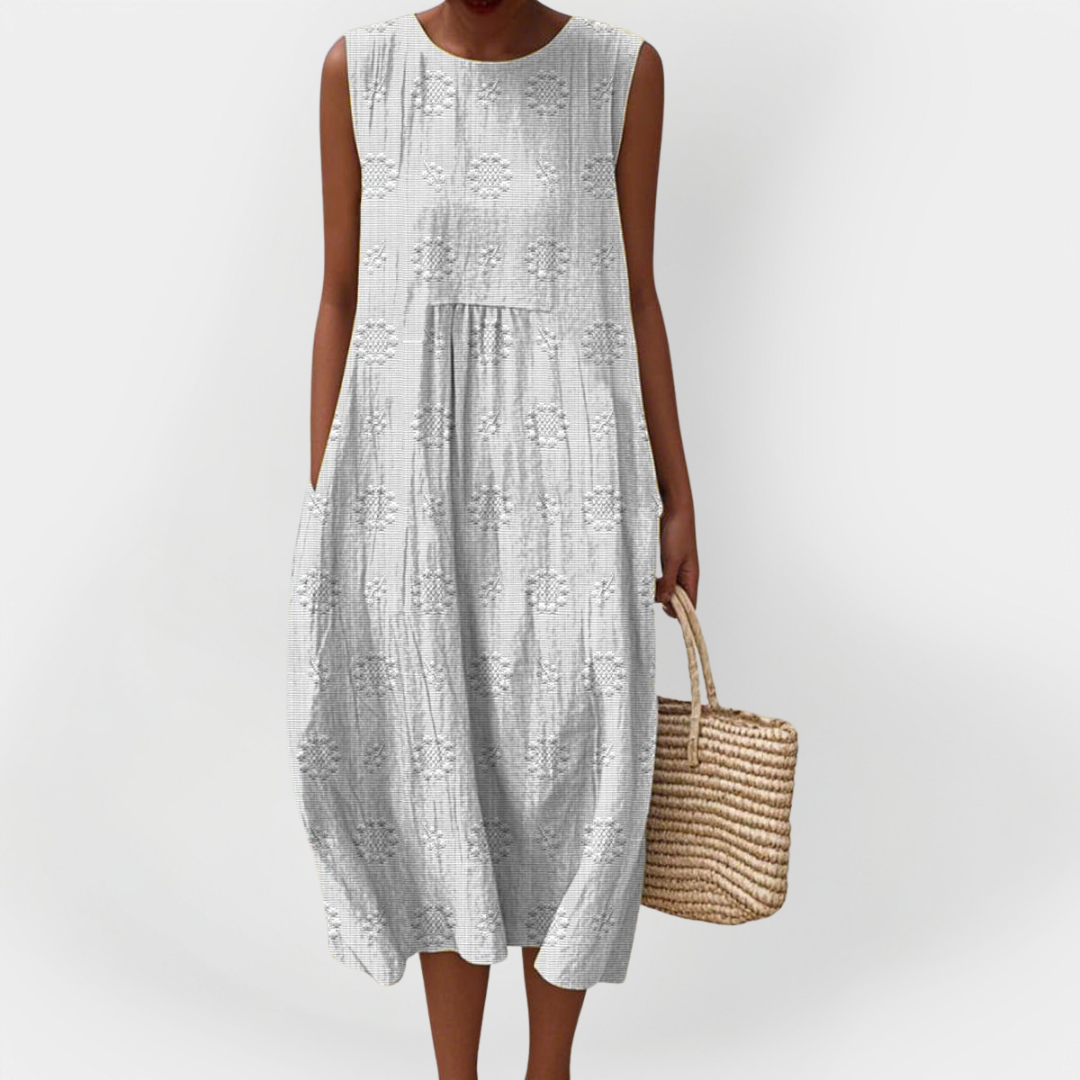 Elegantna brezrokavnik obleka iz bombaža z žepi