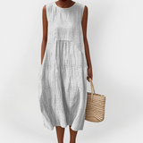 Elegantna brezrokavnik obleka iz bombaža z žepi