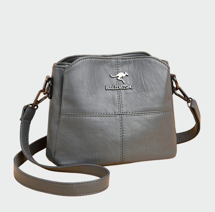 Eleganten usnjen nahrbtnik