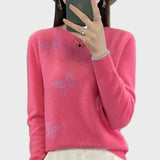 Pleteni pulover z vzorcem metulja