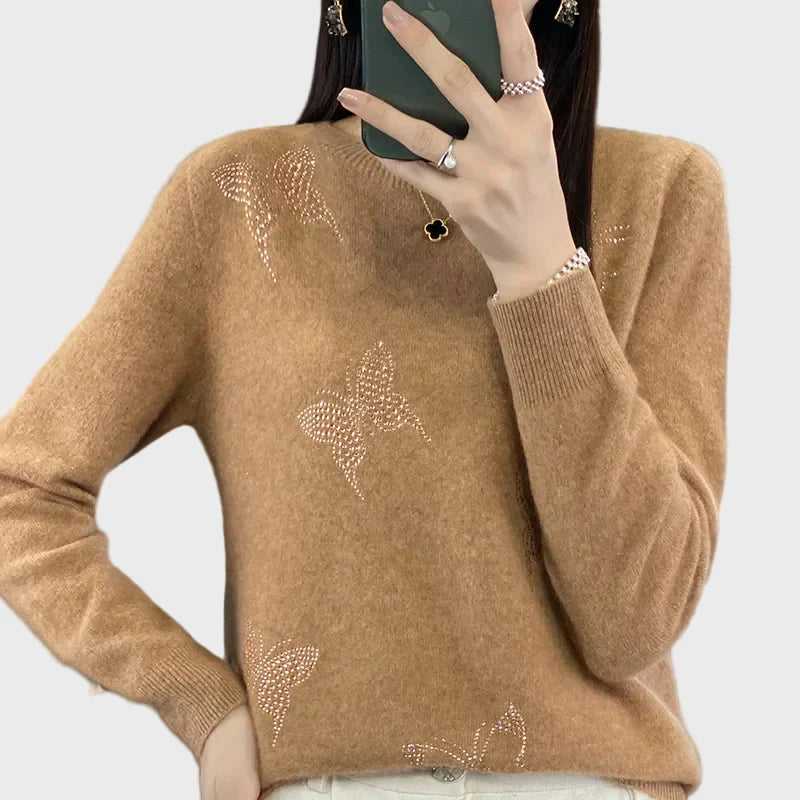 Pleteni pulover z vzorcem metulja