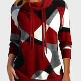 Pleteni pulover z umetniškim vzorcem in kapuco